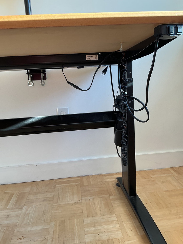 Height-adjustable desk with monitor arm, office chair, and ViewSonic monitors. - image 7 of 13
