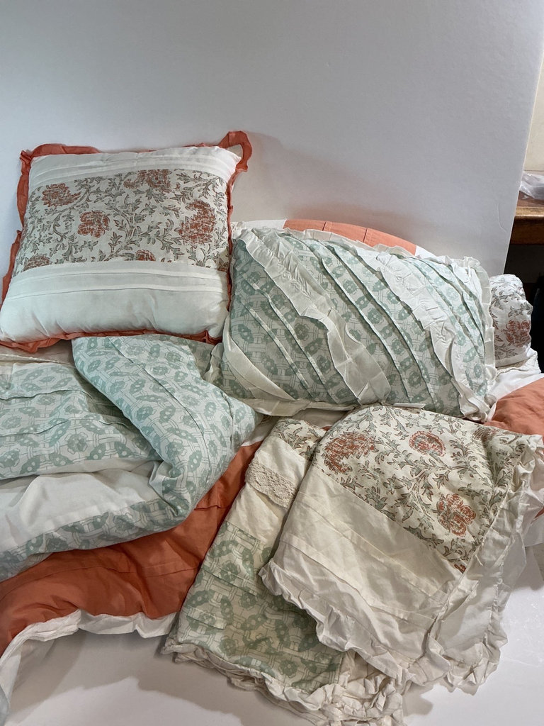 Bedding set with floral patterns and lace trim. - image 1 of 5