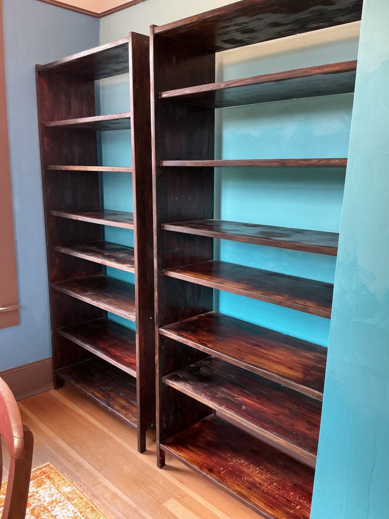 Two tall dark wooden bookcase - image 1 of 3