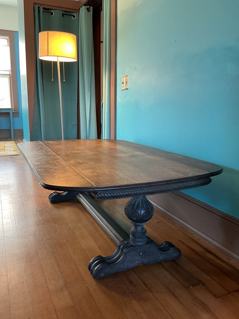 Dark wooden coffee table with ornate carved pedestal bases - image 3 of 7