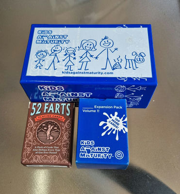 Kids Against Maturity Card Game Set with Expansion and 52 Farts Playing Cards - Image 1 of 3