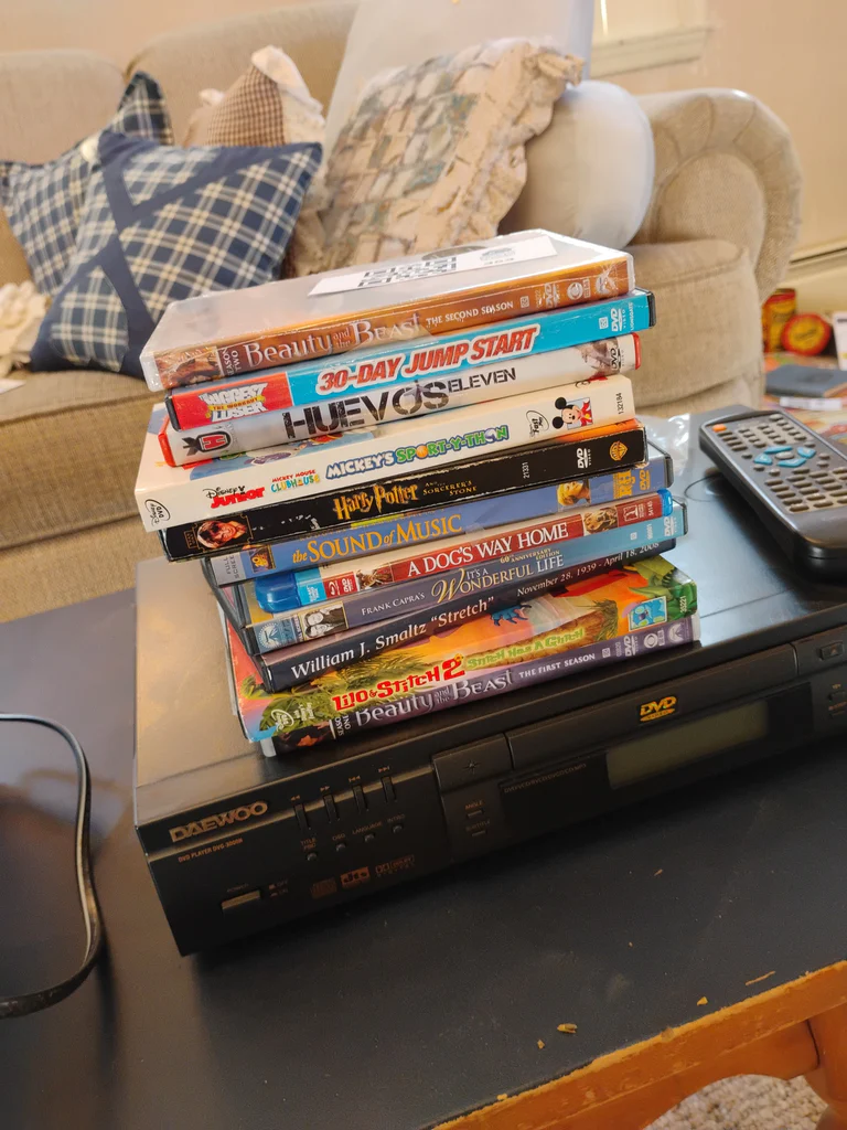 Daewoo DVD Player and Assorted DVDs - image 1 of 4