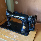 Singer Sewing Machine in Wooden Cabinet - thumbnail 3 of 13