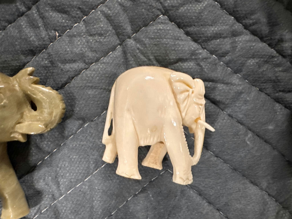 Collection of hand-carved elephant figurines in multiple colors - image 4 of 13