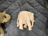 Collection of hand-carved elephant figurines in multiple colors - thumbnail 4 of 13