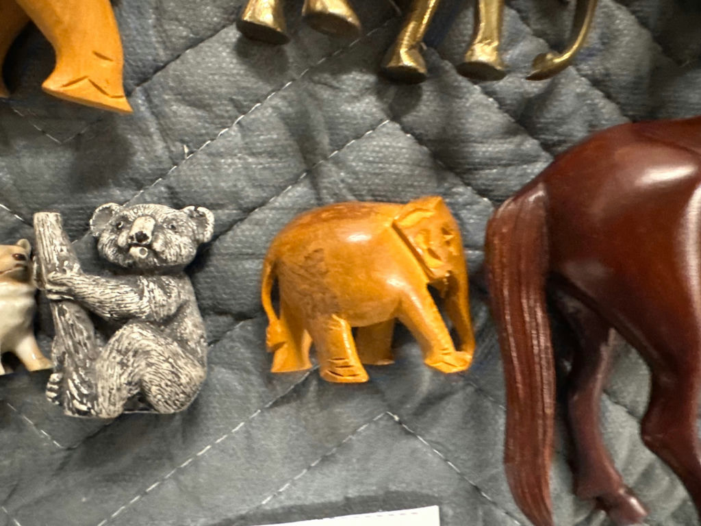 Assorted carved animal figurines including elephants and horse - image 8 of 10