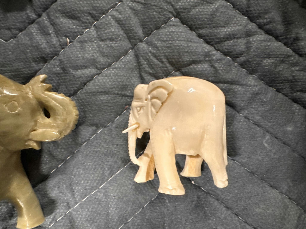 Collection of hand-carved elephant figurines in multiple colors - image 6 of 13