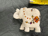 Collection of hand-carved elephant figurines in multiple colors - thumbnail 12 of 13