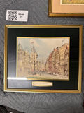 Three framed art prints: cottage scene, city street, and snowy wolf landscape - thumbnail 2 of 4