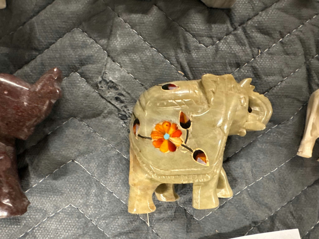 Collection of hand-carved elephant figurines in multiple colors - image 3 of 13