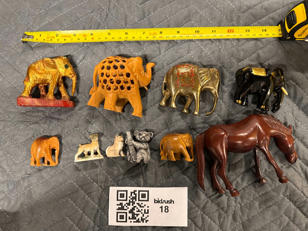Assorted carved animal figurines including elephants and horse - image 1 of 10