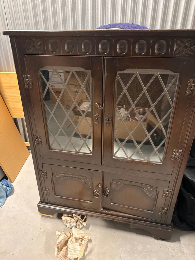 Dark wood cabinet with diamond-paned glass doors - image 1 of 5