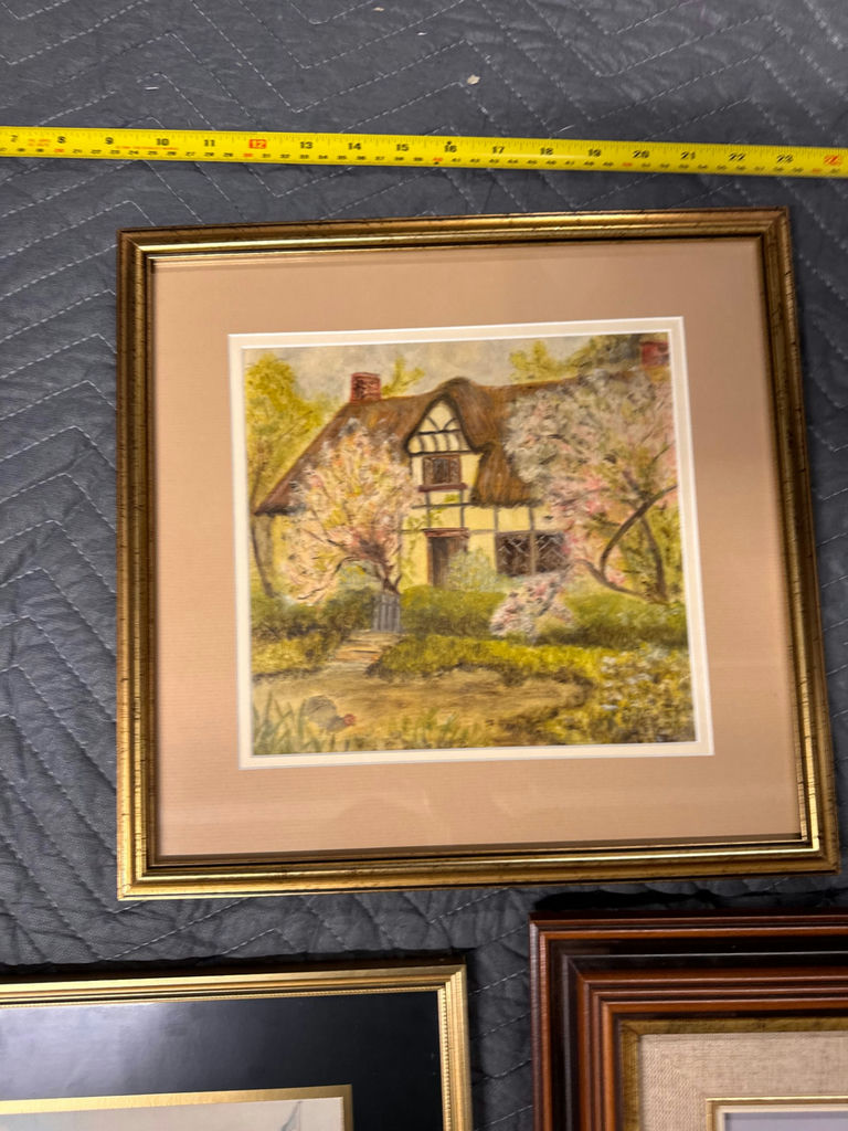 Three framed art prints: cottage scene, city street, and snowy wolf landscape - image 4 of 4