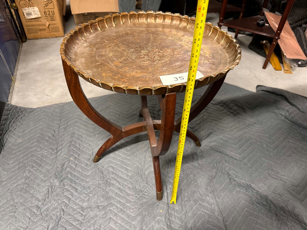 Round metal serving tray on wooden pedestal stand - image 1 of 3