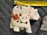 Collection of hand-carved elephant figurines in multiple colors - thumbnail 11 of 13
