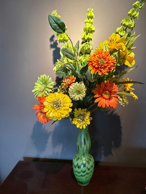 Colorful artificial flower bouquet in a green glass vase - Image 1 of 3