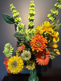 Colorful artificial flower bouquet in a green glass vase - thumbnail 3 of 3