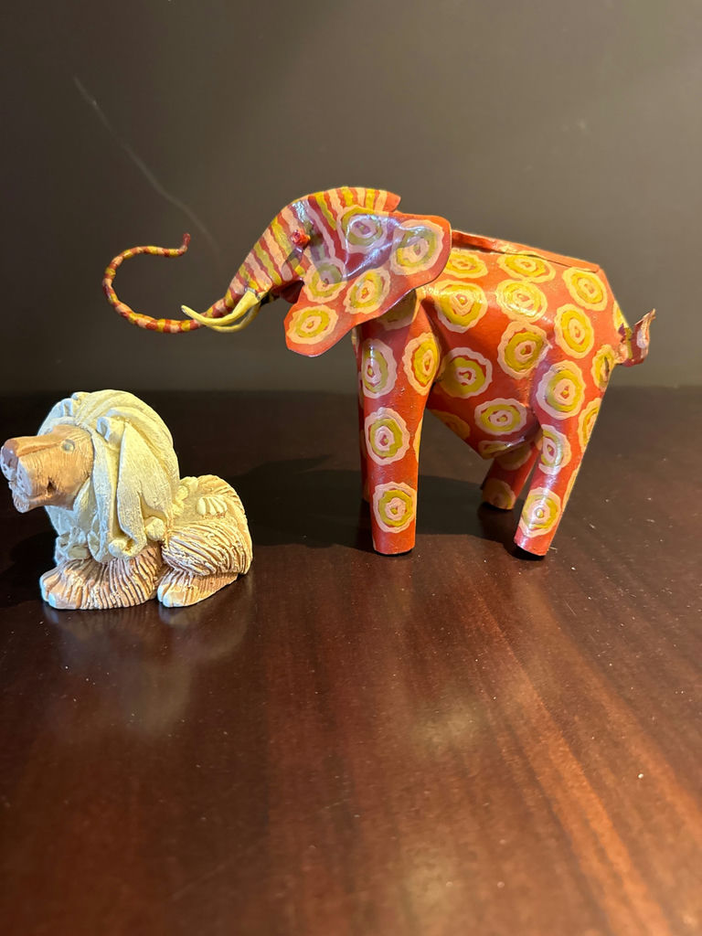 Hand carved animal figurines: painted elephant and carved lion - image 1 of 7
