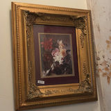 Ornate vintage mirrors, framed floral art, and decorative gold-tone sconce - thumbnail 5 of 15