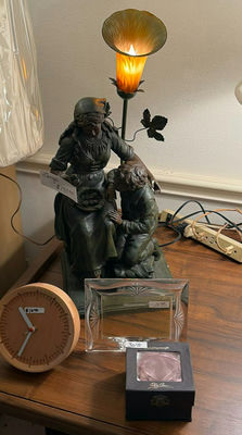 Bronze-toned figurine sculpture, round clock, glass frame, and jewelry box - Image 1 of 4