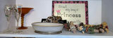 Assorted decorative shelf items: glassware, ceramics, sign and cork figurines - thumbnail 1 of 6