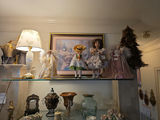 Vintage glassware and porcelain figurine collection on glass shelves - thumbnail 2 of 5