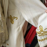 Assorted women's dresses and jackets on a garment rack - thumbnail 5 of 8