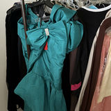 Assorted women's dresses and jackets on a garment rack - thumbnail 2 of 8