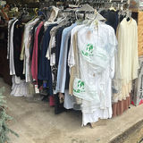 Assorted women's clothing on a rack - thumbnail 1 of 13