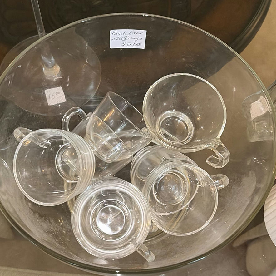 Clear glass teacups with saucers, champagne flute, decanter, and pink hydrangea centerpiece - image 1 of 5