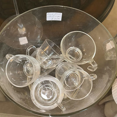 Clear glass teacups with saucers, champagne flute, decanter, and pink hydrangea centerpiece - Image 1 of 5