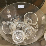 Clear glass teacups with saucers, champagne flute, decanter, and pink hydrangea centerpiece - thumbnail 1 of 5