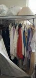 Portable wardrobe closet with hanging clothes - thumbnail 1 of 7