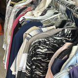 Assorted women's clothing on a rack - thumbnail 4 of 13