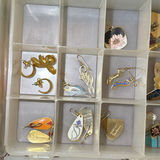 Assorted jewelry collection: earrings, bracelets, brooches, and pendants - thumbnail 9 of 13