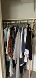 Assorted women's clothing on a clothes rack - thumbnail 1 of 5