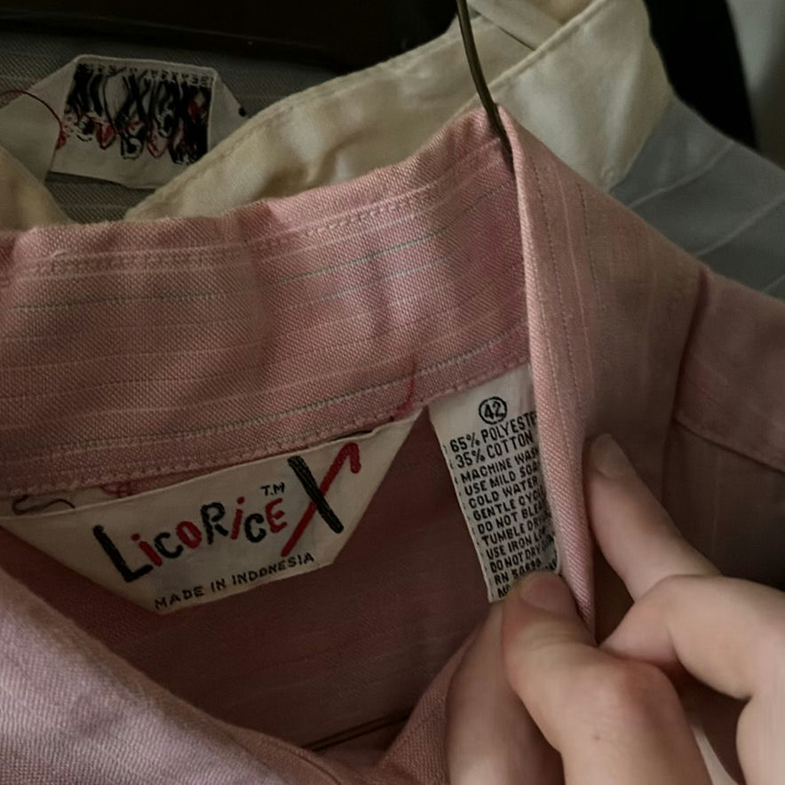 Assorted women's clothing on a clothes rack - image 3 of 5