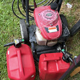 Red Black Max pressure washer with Honda engine and two red gasoline cans - thumbnail 6 of 6