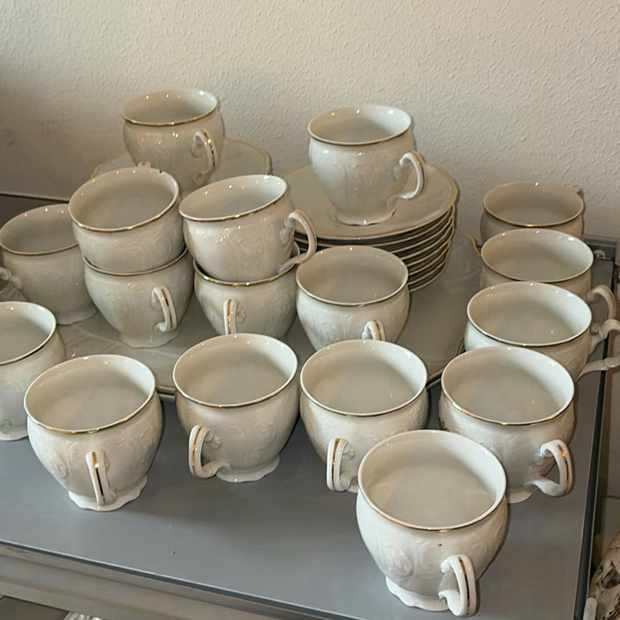 Porcelain dinnerware set with gold-edged plates, bowls, saucers, and cups - image 9 of 9