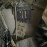 Assorted shirts and blouses on closet hangers - thumbnail 4 of 5