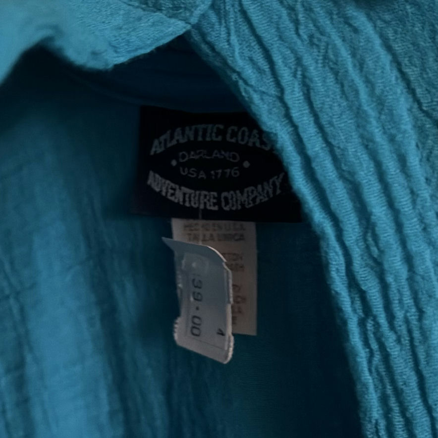 Assorted shirts and blouses on closet hangers - image 5 of 5
