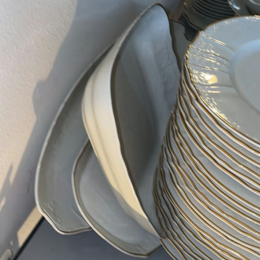 Porcelain dinnerware set with gold-edged plates, bowls, saucers, and cups - image 4 of 9
