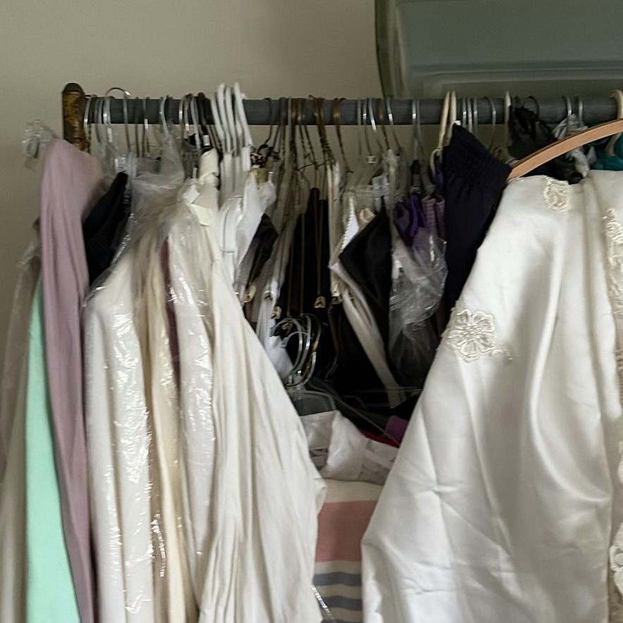 White bridal gowns and formal wear on hangers - image 2 of 4
