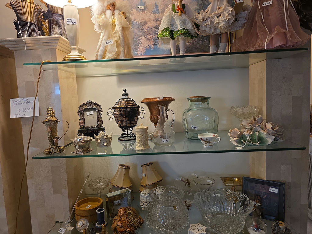 Vintage glassware and porcelain figurine collection on glass shelves - image 3 of 5