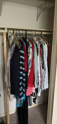 Assorted shirts and blouses on closet hangers - Image 1 of 5