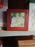 Assorted Christmas-themed decor and vintage photo albums - thumbnail 4 of 19