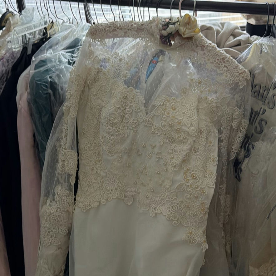 Wedding dress and assorted clothing on a garment rack - image 8 of 15