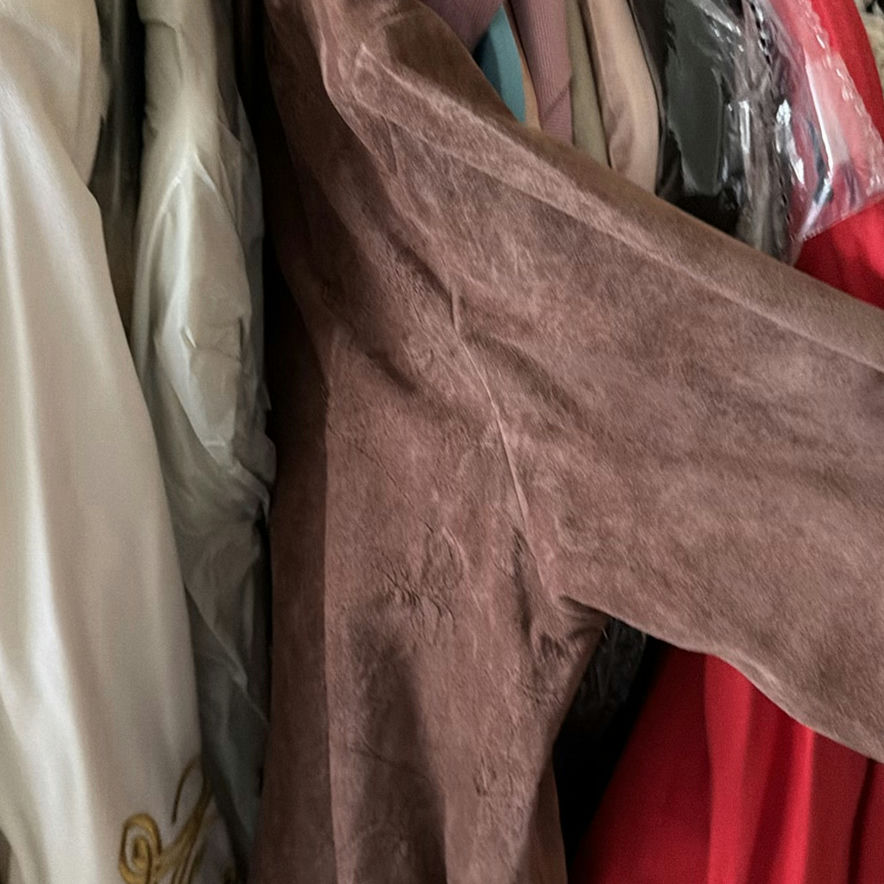Assorted women's dresses and jackets on a garment rack - image 8 of 8