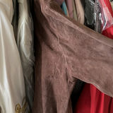Assorted women's dresses and jackets on a garment rack - thumbnail 8 of 8