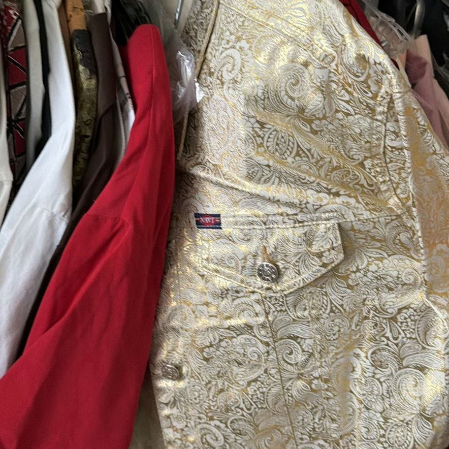 Assorted women's dresses and jackets on a garment rack - image 4 of 8